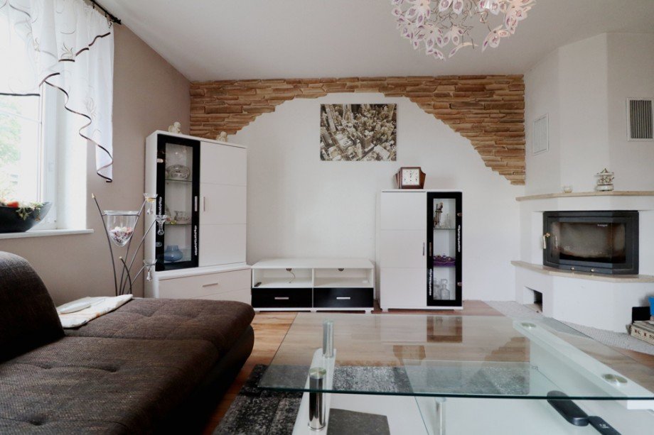 Wohnzimmer mit Kamin Einfamilienhaus Milower Land / M�thlitz